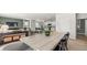 This open-concept living room is adjacent to the kitchen and dining area and features modern finishes and plank flooring at 3038 Manor Hill Pl, Union City, GA 30291