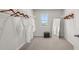 This spacious walk-in closet is complete with ample shelving and storage racks, and a view to the outside at 3038 Manor Hill Pl, Union City, GA 30291