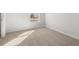 Well-lit bedroom with plush carpeting and a view of the outdoors at 3040 Manor Hill Pl, Union City, GA 30291