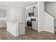 Modern kitchen with stainless steel appliances, granite countertops, island with a sink and wood flooring at 3040 Manor Hill Pl, Union City, GA 30291