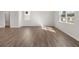 Bright, open living room featuring hardwood floors and natural light from large windows at 3040 Manor Hill Pl, Union City, GA 30291