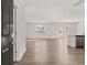 Spacious living room with wood flooring, recessed lighting, and ample natural light, open to the kitchen at 3040 Manor Hill Pl, Union City, GA 30291