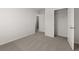 A cozy bedroom with neutral carpeting and a closet for storage at 3042 Manor Hill Pl, Union City, GA 30291