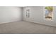 Large bedroom with plush carpeting and windows, offering ample natural light at 3042 Manor Hill Pl, Union City, GA 30291