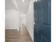 Inviting entryway showcasing luxury vinyl plank flooring and a modern blue front door at 3042 Manor Hill Pl, Union City, GA 30291