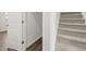 Hallway with stairs, closet, and luxury vinyl plank flooring at 3042 Manor Hill Pl, Union City, GA 30291