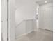 Hallway with carpeting, white trim, and a view of a doorway at 3042 Manor Hill Pl, Union City, GA 30291