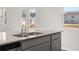 Close-up of kitchen island with granite countertops, stainless steel sink, and stylish faucet at 3042 Manor Hill Pl, Union City, GA 30291
