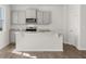 Open kitchen with stainless steel appliances, granite countertops and a kitchen island at 3042 Manor Hill Pl, Union City, GA 30291