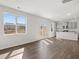 Open concept living room with wood floors, stainless steel appliances, and ample natural light at 3042 Manor Hill Pl, Union City, GA 30291