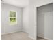 Carpeted bedroom featuring a window and walk-in closet with wire shelving for optimal storage at 3044 Manor Hill Pl, Union City, GA 30291