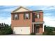 Charming brick two-story home featuring an attached two car garage and a welcoming front entryway at 3044 Manor Hill Pl, Union City, GA 30291