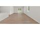 Open living room with hardwood floors, and a view of the back yard at 3044 Manor Hill Pl, Union City, GA 30291