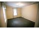 A compact bedroom features carpet, one window and neutral paint at 329 Kelly Mill Rd, Cumming, GA 30040