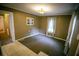 Cozy living area with neutral carpet, natural light, and warm-toned walls, creating a comfortable ambiance at 329 Kelly Mill Rd, Cumming, GA 30040