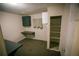 A small room features a closet and desk with wall storage at 329 Kelly Mill Rd, Cumming, GA 30040