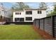 Spacious backyard with a modern deck and privacy fence; ideal for Gathering enjoyment at 4132 Carmain Ne Dr, Atlanta, GA 30342