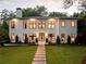 Stunning two-story home with a manicured lawn and elegant walkway leading to the front entrance at 4132 Carmain Ne Dr, Atlanta, GA 30342
