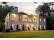 Elegant home with expansive lawn and meticulously landscaped grounds, perfect for Gathering living at 4132 Carmain Ne Dr, Atlanta, GA 30342