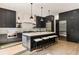 Spacious kitchen with a large island, seating, stainless steel appliances, and wooden floors at 4132 Carmain Ne Dr, Atlanta, GA 30342