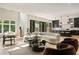 Spacious living room with comfortable seating arrangement, hardwood floors, and seamless kitchen access at 4132 Carmain Ne Dr, Atlanta, GA 30342