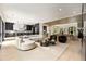 Cozy living room, hardwood floors, seamless transition to kitchen and dining area for entertaining at 4132 Carmain Ne Dr, Atlanta, GA 30342