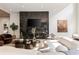 Bright living room with modern fireplace feature, hardwood floors, and comfortable seating arrangement at 4132 Carmain Ne Dr, Atlanta, GA 30342