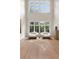 Sun-drenched living room with floor-to-ceiling windows and minimalist modern design at 4132 Carmain Ne Dr, Atlanta, GA 30342