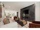 Open concept living area with sleek marble fireplace and comfortable seating offering contemporary charm at 4132 Carmain Ne Dr, Atlanta, GA 30342