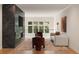 Bright living room boasts large windows, modern furnishings, and a striking marble fireplace with built-in television at 4132 Carmain Ne Dr, Atlanta, GA 30342