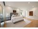 A light and airy main bedroom with a large bed, soft rug, and minimalist decor at 4132 Carmain Ne Dr, Atlanta, GA 30342