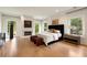 Bright main bedroom with ample natural light, fireplace, and stylish furnishings at 4132 Carmain Ne Dr, Atlanta, GA 30342