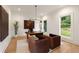 Bright home office with modern decor, large windows, and comfortable seating at 4132 Carmain Ne Dr, Atlanta, GA 30342