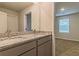 Bathroom with double sink vanity, granite countertop, and modern faucets at 250 Crabapple Rd, Mcdonough, GA 30253