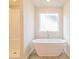 Contemporary bathroom with a sleek soaking tub and a separate glass-enclosed shower at 250 Crabapple Rd, Mcdonough, GA 30253
