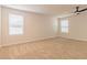 Bright, spacious bedroom with neutral carpeting and large windows offering natural light at 250 Crabapple Rd, Mcdonough, GA 30253