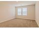 Cozy bedroom featuring neutral carpet and double window providing ample natural light at 250 Crabapple Rd, Mcdonough, GA 30253