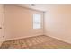 Comfortable bedroom with neutral carpet and a large window for natural light at 250 Crabapple Rd, Mcdonough, GA 30253