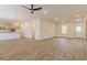 Large living room with wood-look flooring, modern fixtures, and neutral color scheme at 250 Crabapple Rd, Mcdonough, GA 30253