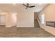 Spacious living room with modern ceiling fan, beautiful floors, and recessed lighting at 250 Crabapple Rd, Mcdonough, GA 30253