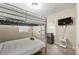 Well-lit bedroom with bunk beds, mini-fridge, and TV, offering a comfortable and fun space at 2794 7Th Sw St, Atlanta, GA 30315