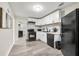Well-equipped kitchen featuring white cabinets, modern appliances, and an efficient layout for meal preparation at 2794 7Th Sw St, Atlanta, GA 30315