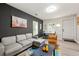 Stylish living room boasts contemporary decor, neutral sofa, and a chic accent chair, perfect for relaxation at 2794 7Th Sw St, Atlanta, GA 30315