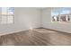 Bedroom with hardwood flooring and large windows allowing plenty of natural light at 3046 Manor Hill Pl, Union City, GA 30291