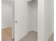 Bedroom closet with an open door, wire shelving, and neutral carpet flooring at 3048 Manor Hill Pl, Union City, GA 30291
