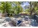 Back deck with modern outdoor furniture and overlooks the professionally landscaped backyard at 139 Sisson Ne Ave, Atlanta, GA 30317