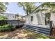 This backyard leads to a deck with stone steps and a professionally landscaped lawn at 139 Sisson Ne Ave, Atlanta, GA 30317