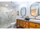 Modern bathroom with dual sink vanity, glass enclosed shower, and stylish fixtures at 139 Sisson Ne Ave, Atlanta, GA 30317