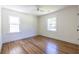 Bright empty bedroom with wood floors, white walls, and natural light at 139 Sisson Ne Ave, Atlanta, GA 30317