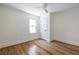 This bedroom features hardwood floors, neutral paint, crown molding, a ceiling fan, and a closet at 139 Sisson Ne Ave, Atlanta, GA 30317